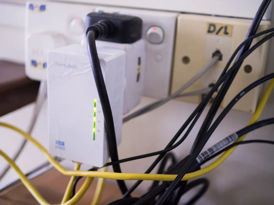 Photo - Powerline WiFi extender on second floor while 4G router is on first floor